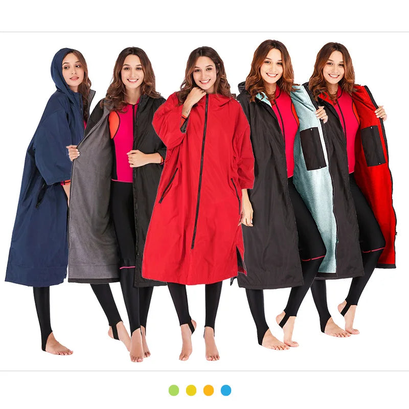 Women modeling waterproof surf changing robes in various colors, showcasing cozy fleece lining and hooded design.