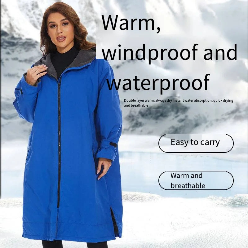 Woman in a blue windproof robe highlighting warmth, waterproof features, and easy carrying for outdoor activities.