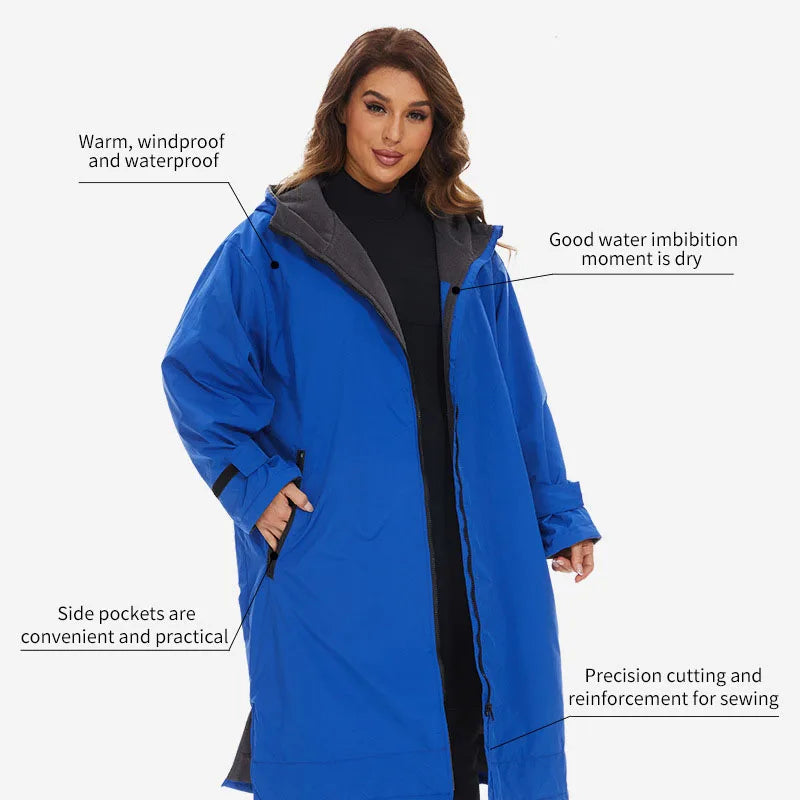 Woman wearing a blue waterproof and windproof coat with practical side pockets and precision cutting details.