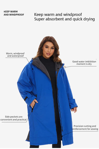 Woman wearing a blue waterproof poncho coat with pockets, highlighting its warmth and quick-drying features.